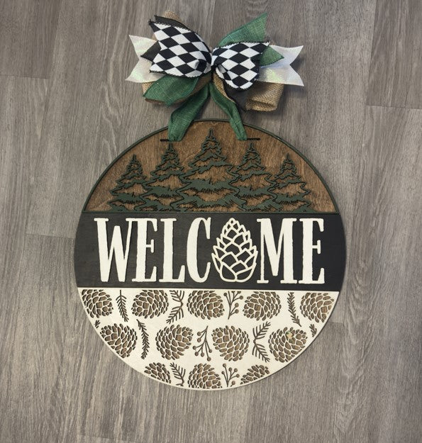 "Welcome" with Pine Cones and Trees Christmas Round Sign