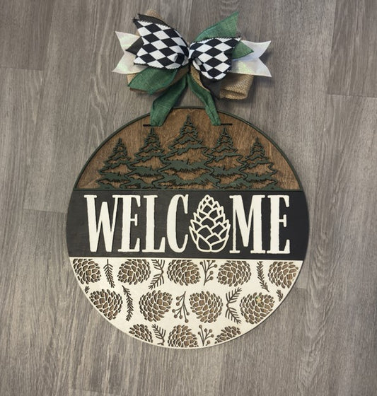 "Welcome" with Pine Cones and Trees Christmas Round Sign